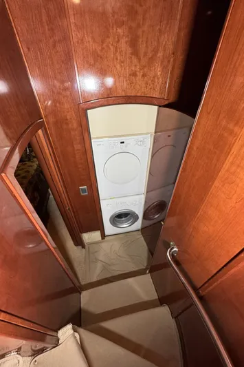 Yacht Photos Pics Laundry area in 2008 Meridian 580 Pilothouse yacht with wood paneling.