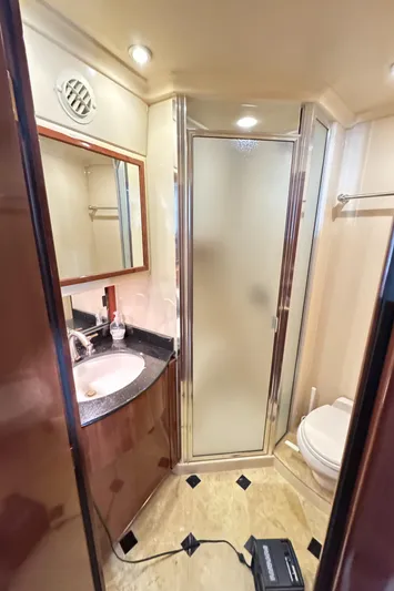  Yacht Photos Pics 2008 Meridian 580 Pilothouse bathroom with shower, sink, and toilet. Luxurious yacht interior.