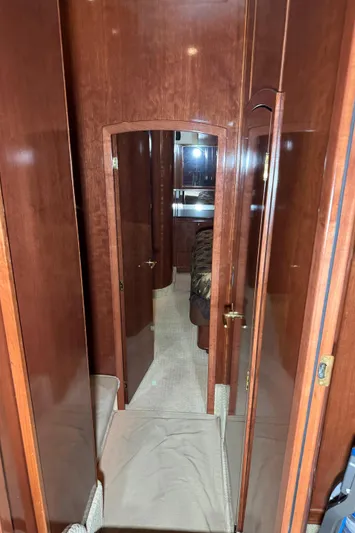  Yacht Photos Pics Interior hallway of 2008 Meridian 580 Pilothouse yacht with wooden finish.