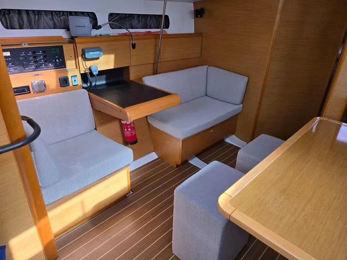  Yacht Photos Pics Interior of 2012 Jeanneau Sun Odyssey 439 yacht with seating and navigation equipment.
