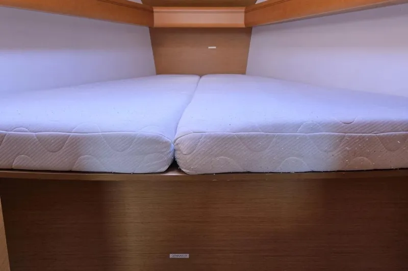  Yacht Photos Pics Cozy cabin bed in 2012 Jeanneau Sun Odyssey 439 sailboat interior.