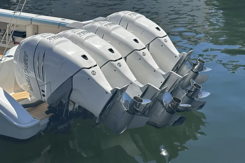  Yacht Photos Pics 2018 Yellowfin 42 boat with four powerful outboard engines on water.