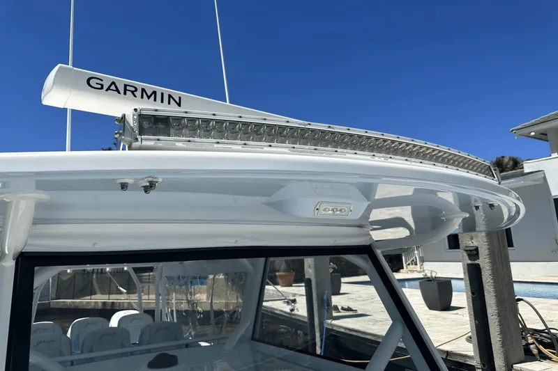  Yacht Photos Pics 2018 Yellowfin 42 boat with Garmin radar, docked under clear blue sky.