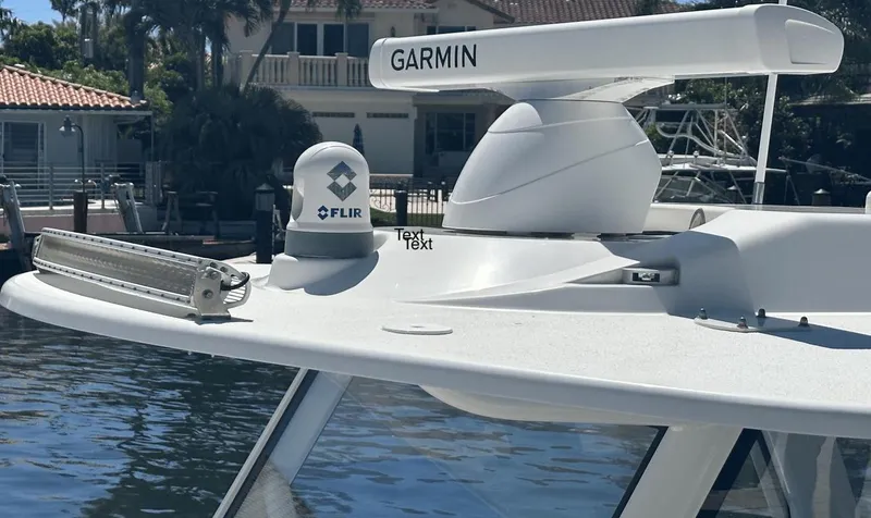  Yacht Photos Pics 2018 Yellowfin 42 boat with Garmin and FLIR equipment, docked near waterfront homes.