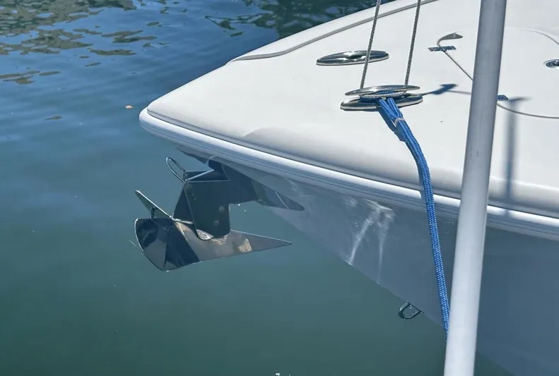  Yacht Photos Pics 2018 Yellowfin 42 boat anchored on calm water.