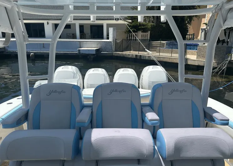  Yacht Photos Pics 2018 Yellowfin 42 boat with cushioned seating and multiple outboard engines.