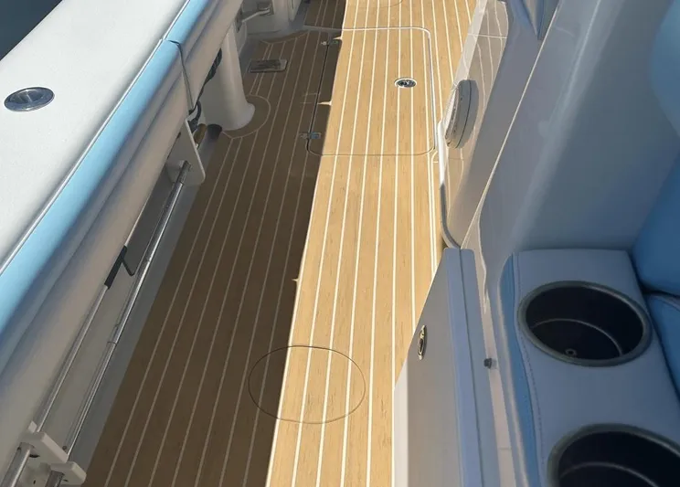  Yacht Photos Pics 2018 Yellowfin 42 boat deck with teak flooring and cup holders.