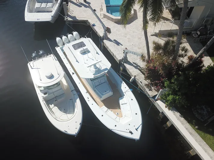  Yacht Photos Pics Aerial view of 2018 Yellowfin 42 boat docked beside another vessel.