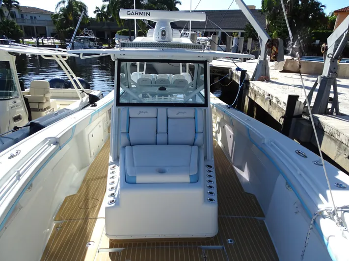 Yacht Photos Pics 2018 Yellowfin 42 boat with Garmin equipment, docked in a marina.