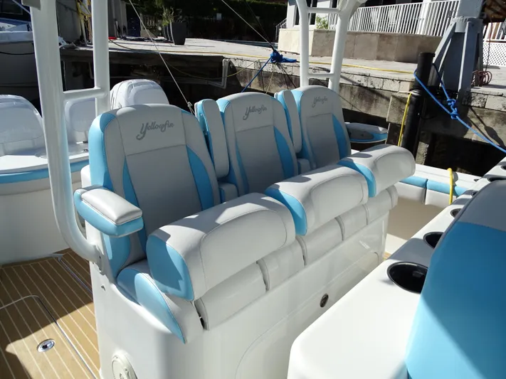  Yacht Photos Pics 2018 Yellowfin 42 boat with blue and white cushioned seats.