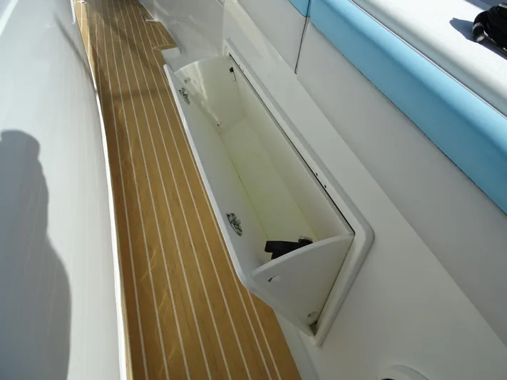  Yacht Photos Pics Open storage compartment on 2018 Yellowfin 42 boat with teak flooring.