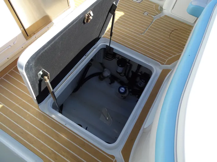  Yacht Photos Pics Open hatch on 2018 Yellowfin 42 boat deck, revealing storage compartment.