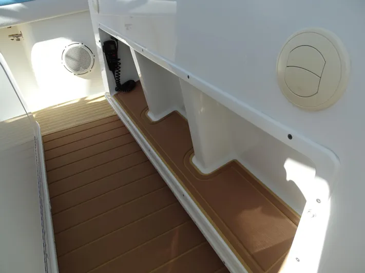  Yacht Photos Pics 2018 Yellowfin 42 boat interior with storage compartments and speaker.