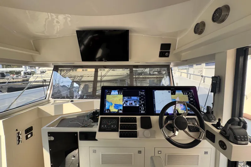  Yacht Photos Pics Cockpit of 2023 Nord Star 49 SCY with advanced navigation displays and steering wheel.