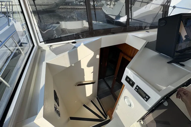  Yacht Photos Pics Interior view of 2023 Nord Star 49 SCY yacht, showcasing stairs and control panel.