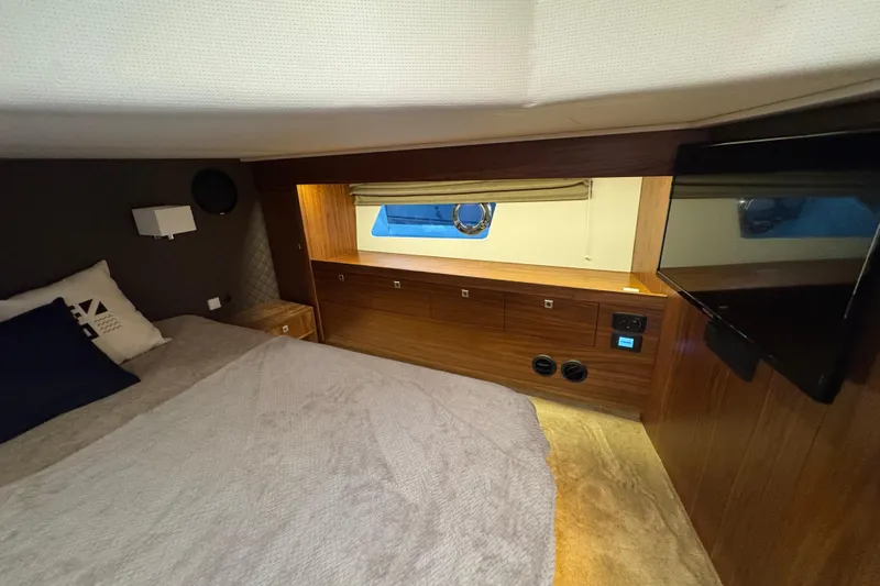  Yacht Photos Pics Luxurious cabin interior of 2023 Nord Star 49 SCY yacht with cozy bed and modern amenities.