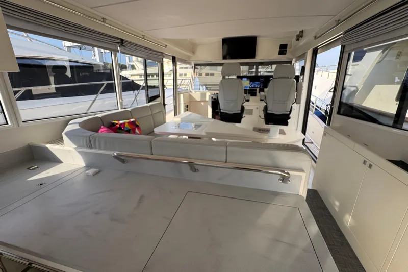  Yacht Photos Pics Luxurious interior of 2023 Nord Star 49 SCY yacht with modern seating and helm.