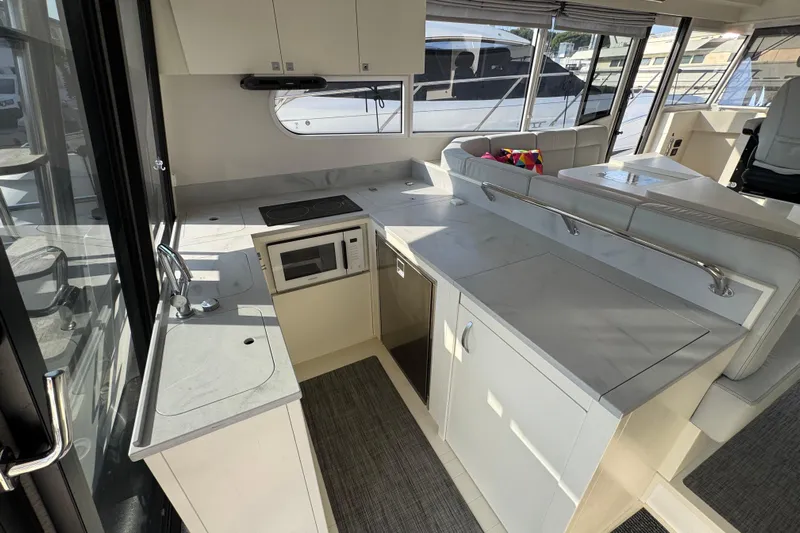  Yacht Photos Pics Modern kitchen area in 2023 Nord Star 49 SCY yacht, featuring sleek countertops and appliances.