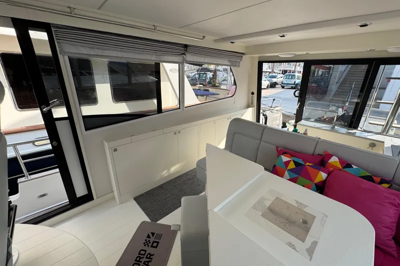  Yacht Photos Pics Interior of 2023 Nord Star 49 SCY yacht with modern seating and colorful cushions.