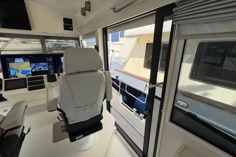  Yacht Photos Pics Interior view of 2023 Nord Star 49 SCY yacht cockpit with navigation screens.