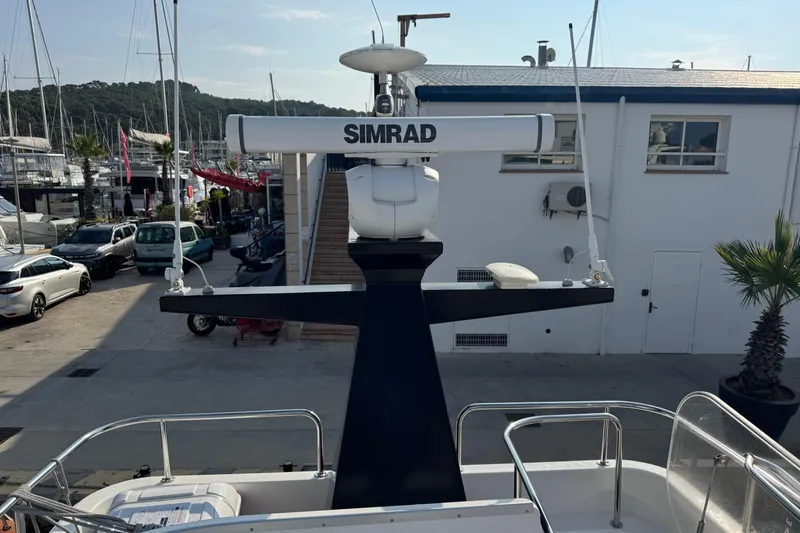  Yacht Photos Pics Radar equipment on 2023 Nord Star 49 SCY yacht, docked at marina with surrounding boats.