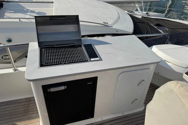  Yacht Photos Pics Outdoor kitchen on 2023 Nord Star 49 SCY yacht with grill and mini fridge.