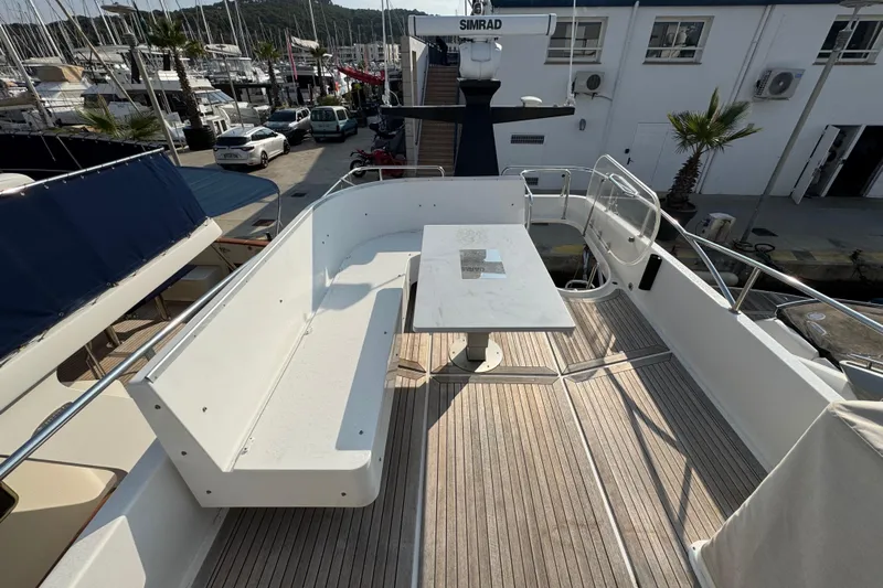  Yacht Photos Pics Deck view of 2023 Nord Star 49 SCY yacht with seating and table.