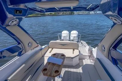  Yacht Photos Pics 2024 Hanover 305 White & Blue Edition boat interior with luxurious seating and scenic water view.