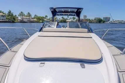  Yacht Photos Pics 2024 Hanover 305 White & Blue Edition boat on a sunny waterway.