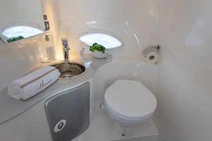  Yacht Photos Pics 2024 Hanover 305 White & Blue Edition bathroom with modern sink and toilet.