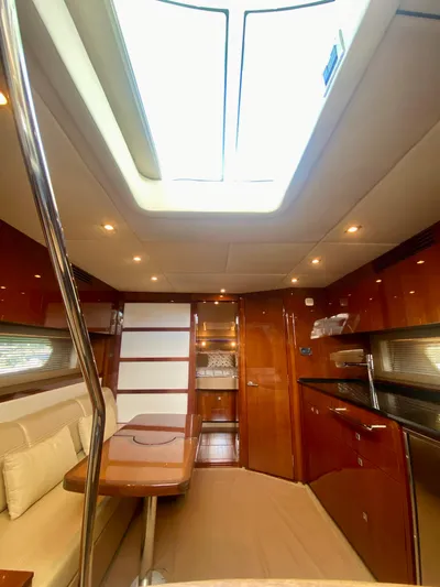 Hyde-a-way Yacht Photos Pics Interior of 2010 Sea Ray 450 Sundancer yacht with skylight and modern furnishings.