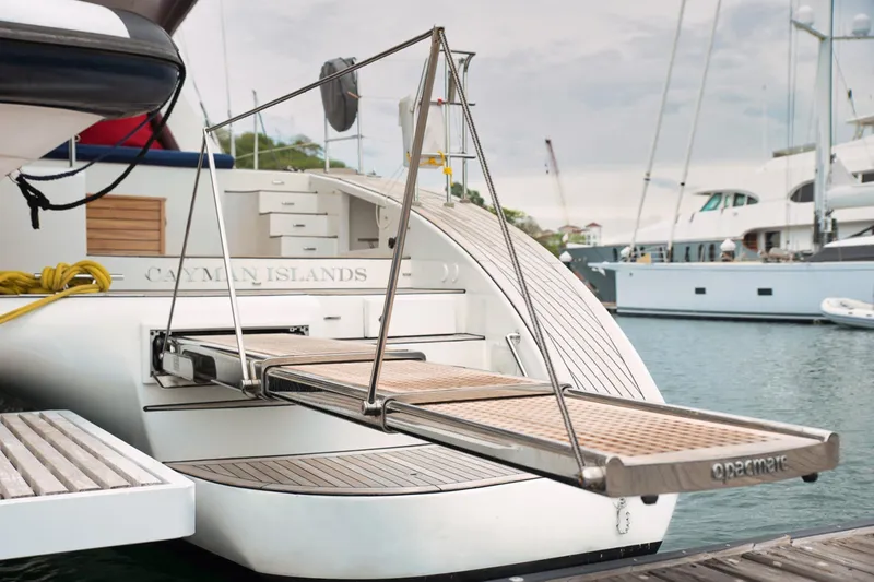 Kailua Yacht Photos Pics Luxury Sunreef 74 yacht, 2018 model, docked with extended gangway in Cayman Islands marina.
