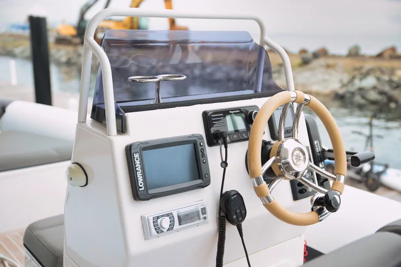 Kailua Yacht Photos Pics Steering console of 2018 Sunreef 74 yacht with navigation equipment and controls.