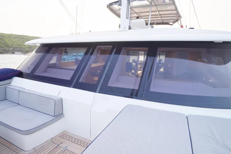 Kailua Yacht Photos Pics Luxurious 2018 Sunreef 74 yacht with sleek windows and comfortable seating on deck.