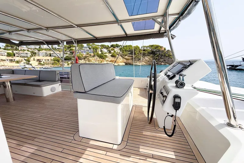 Kailua Yacht Photos Pics Luxurious 2018 Sunreef 74 yacht deck with modern seating and navigation controls.