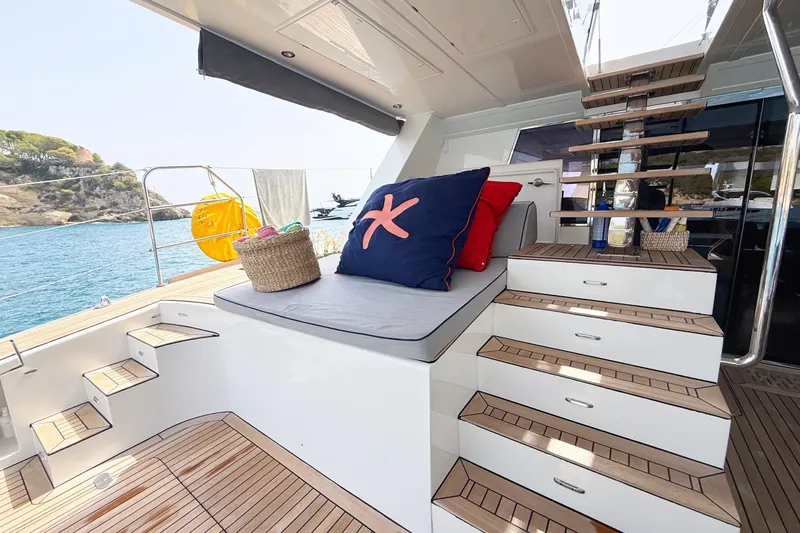 Kailua Yacht Photos Pics Luxurious Sunreef 74 yacht interior with wooden stairs and cozy seating, 2018 model.