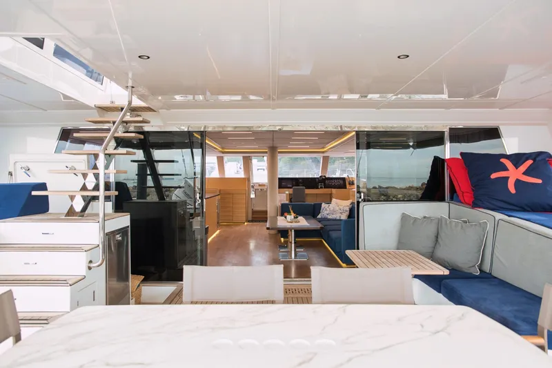 Kailua Yacht Photos Pics Luxurious interior of 2018 Sunreef 74 yacht with modern seating and elegant design.