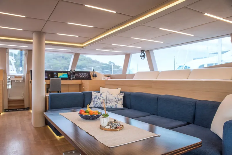 Kailua Yacht Photos Pics Luxurious interior of 2018 Sunreef 74 yacht with modern seating and elegant decor.