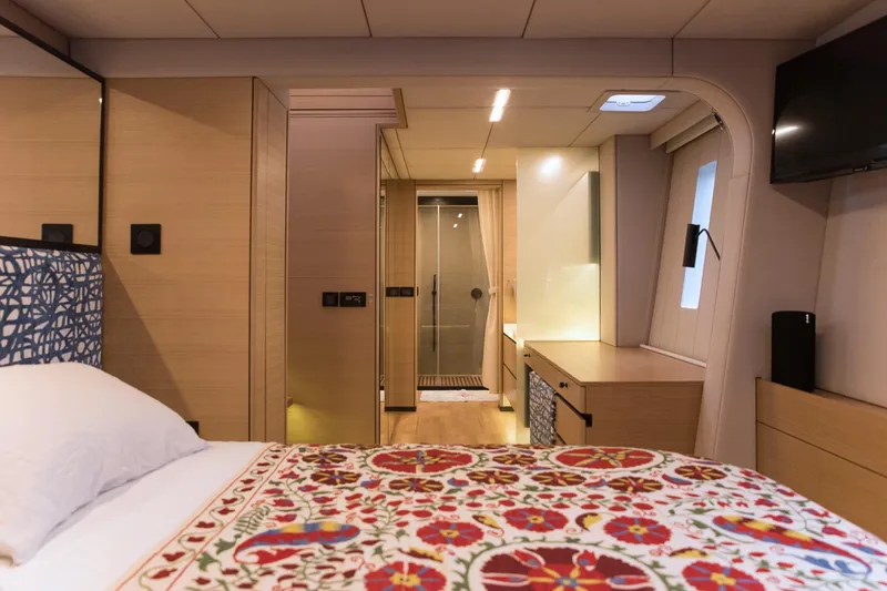 Kailua Yacht Photos Pics Luxurious Sunreef 74 yacht interior, 2018 model, featuring elegant bedroom and modern design.
