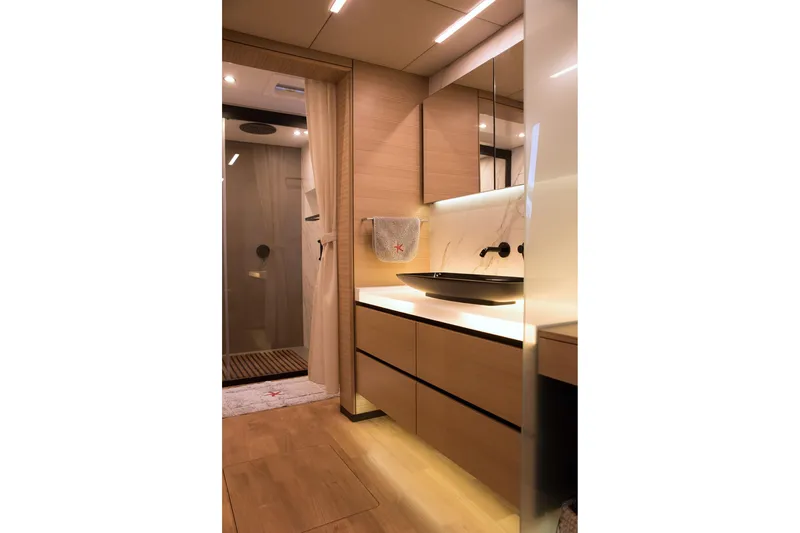 Kailua Yacht Photos Pics Luxurious bathroom interior of 2018 Sunreef 74 yacht with modern fixtures and elegant design.