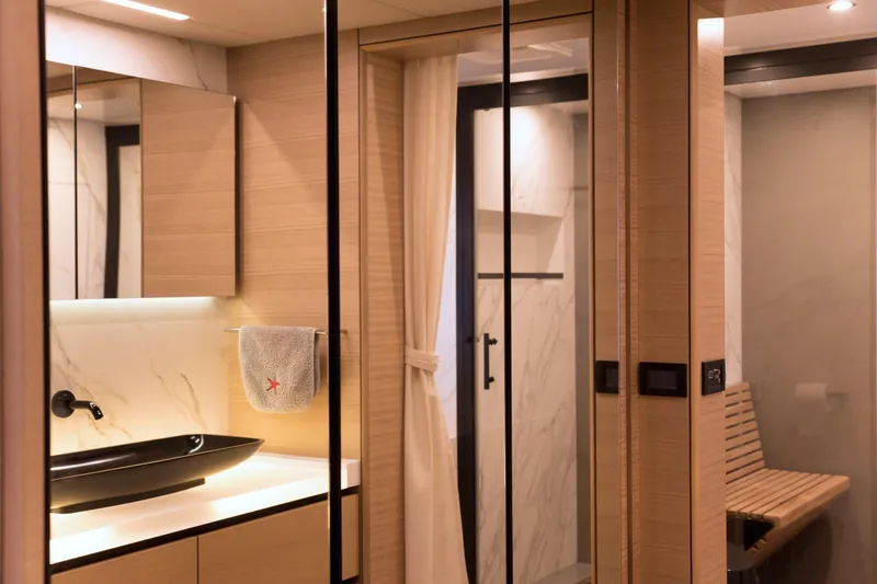 Kailua Yacht Photos Pics Luxurious bathroom interior of 2018 Sunreef 74 yacht with modern fixtures and elegant design.
