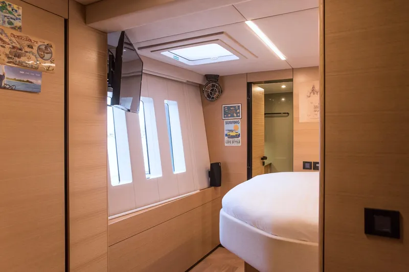 Kailua Yacht Photos Pics Luxurious interior of 2018 Sunreef 74 yacht cabin with modern decor and natural lighting.