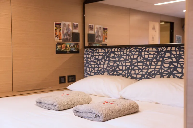 Kailua Yacht Photos Pics Luxurious Sunreef 74 yacht bedroom interior, 2018 model, with modern decor and cozy bedding.