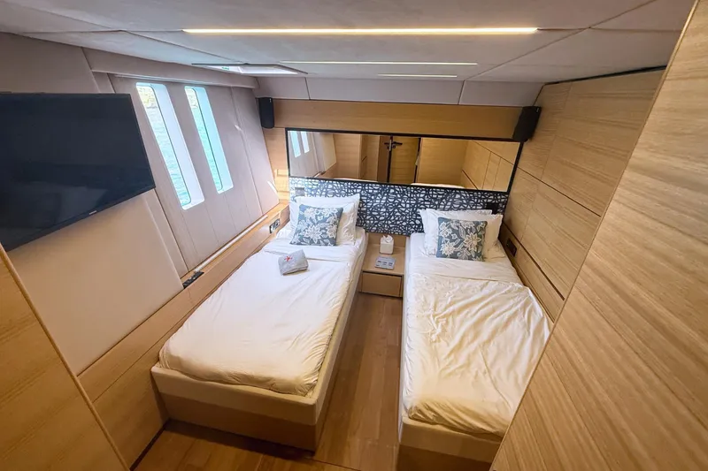 Kailua Yacht Photos Pics Luxurious cabin interior of 2018 Sunreef 74 yacht with twin beds and modern decor.