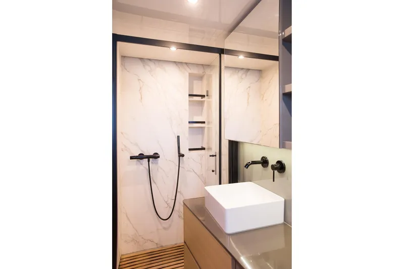 Kailua Yacht Photos Pics Luxurious bathroom in 2018 Sunreef 74 yacht with modern fixtures and marble accents.