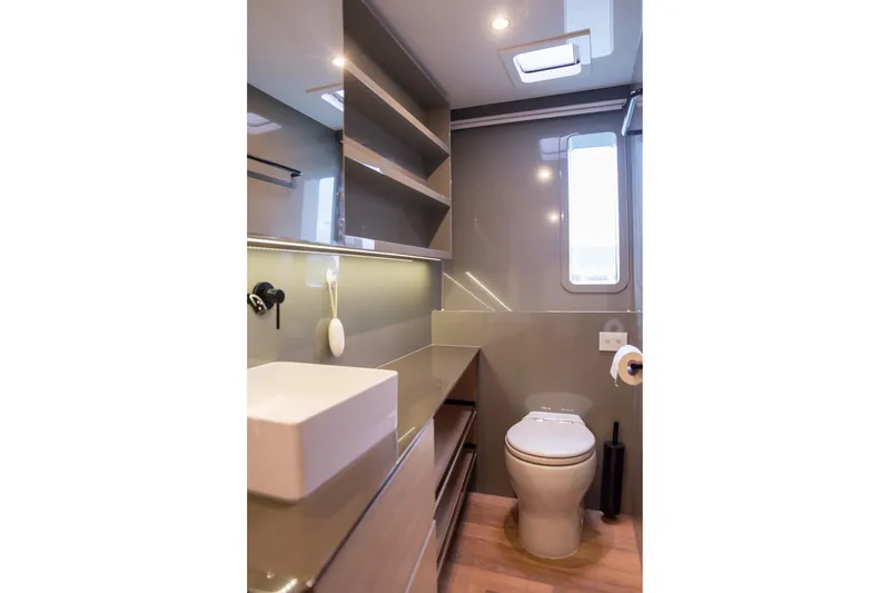 Kailua Yacht Photos Pics Modern bathroom interior on 2018 Sunreef 74 yacht, featuring sleek design and amenities.