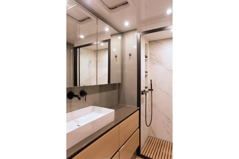 Kailua Yacht Photos Pics Luxurious bathroom in 2018 Sunreef 74 yacht with modern fixtures and elegant design.