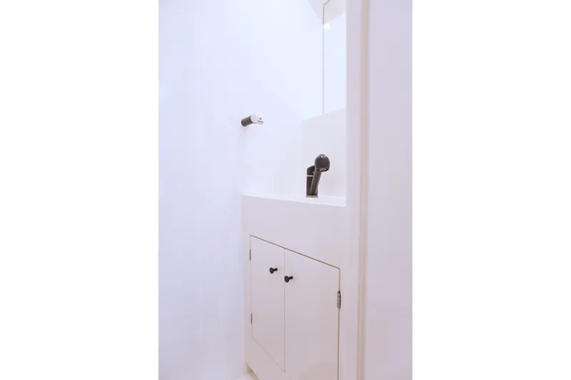 Kailua Yacht Photos Pics Minimalist bathroom sink area on 2018 Sunreef 74 yacht, featuring sleek black faucet.