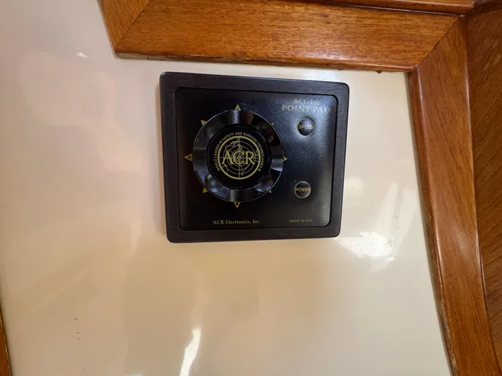 Tamarack Yacht Photos Pics ACR Electronics control panel on 1999 Hinckley Picnic boat interior.