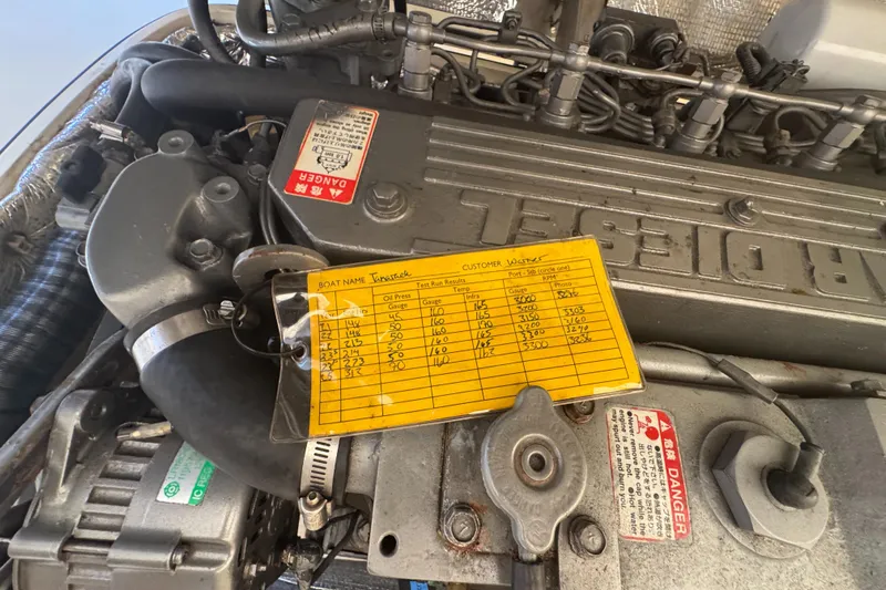 Tamarack Yacht Photos Pics Engine of a 1999 Hinckley Picnic boat with maintenance log attached.